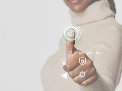 Woman scanning fingerprint with futuristic interface smart technology